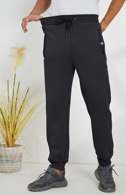Black Gihuo Men's Sherpa Lined Athletic Sweatpants, front view on model