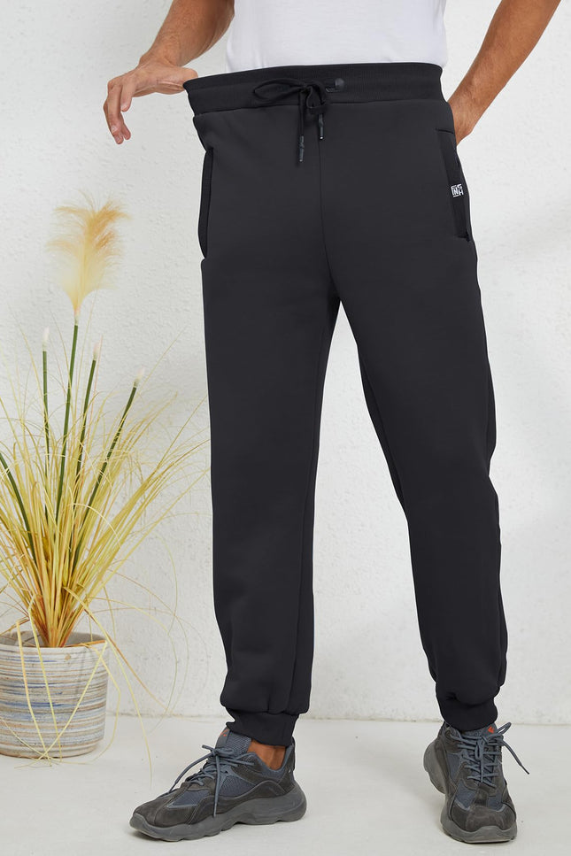 Black Gihuo Men's Sherpa Lined Athletic Sweatpants, front view on model