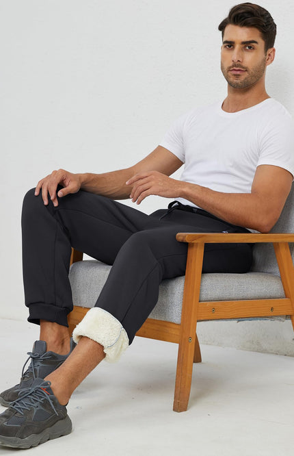 Black Gihuo Men's Sherpa Lined Athletic Sweatpants, side view on model