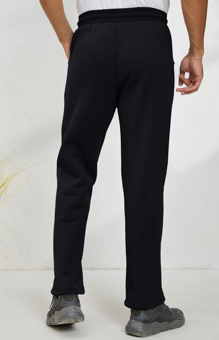 Black Gihuo Men's Sherpa Lined Sweatpants, back view on model