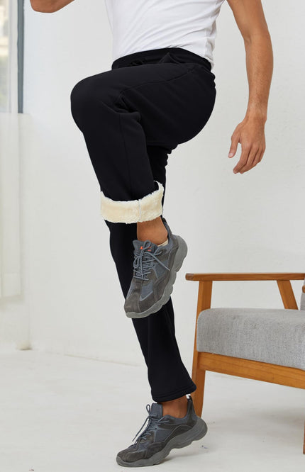 Black Gihuo Men's Sherpa Lined Sweatpants, side view on model